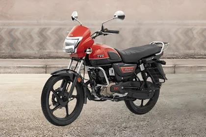 TVS Radeon All Black Edition motorcycle parked on city street with LED DRL