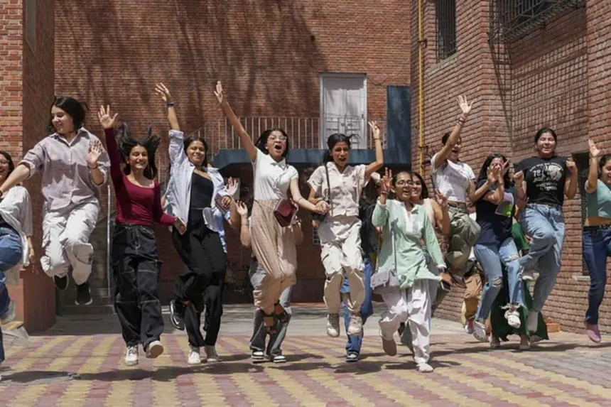 Students celebrating CBSE Class 12 results in Vijayawada, topping with 99.60% pass rate in 2025