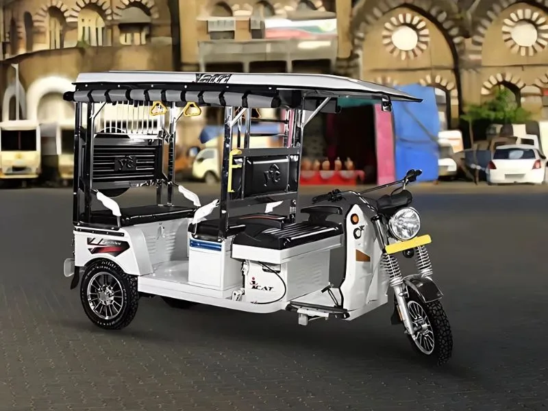 Interior of YC Electric Yatri Deluxe 2025 cabin with analogue dashboard and 4-seater configuration for efficient rides