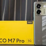 POCO M7 Pro smartphone showcasing its AMOLED display in a tech store in 2025