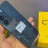 Realme C73 5G smartphone in Jade Green displayed in a tech store in India in 2025