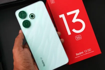 Xiaomi Redmi 13 5G smartphone displaying its sleek design in a tech store in 2025