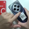 Xiaomi Redmi 14C 5G smartphone showcasing its premium design in a tech store in 2025