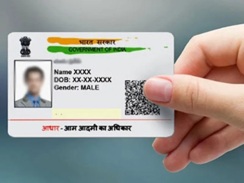 People at an Aadhaar Seva Kendra updating their Aadhaar card details in 2025.