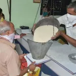 Ration card holders in Andhra Pradesh receiving essential commodities like oil and flour at a fair price shop in 2025.