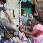Ration dealer delivering supplies to a senior citizen’s home in Andhra Pradesh under the 2025 door delivery scheme starting June 26.