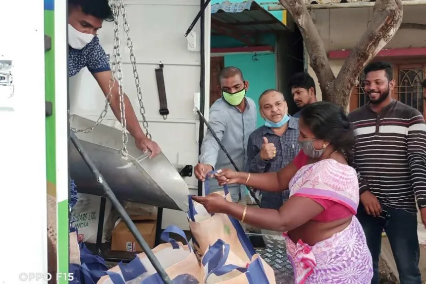 Ration dealer delivering supplies to a senior citizen’s home in Andhra Pradesh under the 2025 door delivery scheme starting June 26.