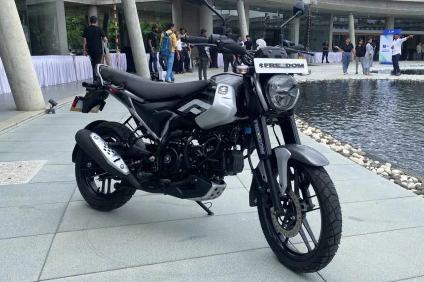 Bajaj Freedom 125 CNG in Garnet Red, now priced at Rs 85,976 with a Rs 5,000 discount in 2025, offering 330 km mileage.