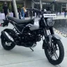 Bajaj Freedom 125 CNG in Garnet Red, now priced at Rs 85,976 with a Rs 5,000 discount in 2025, offering 330 km mileage.