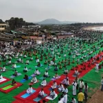Hundreds practicing yoga at Chintapalli Beach in Vizianagaram during Yogandhra 2025