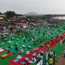 Hundreds practicing yoga at Chintapalli Beach in Vizianagaram during Yogandhra 2025