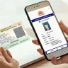 user scanning e-Aadhaar QR code for verification, India 2025