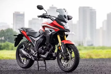 Honda CB200X 2025 in Sports Red, showcasing rugged adventure design with 184cc engine for Indian riders