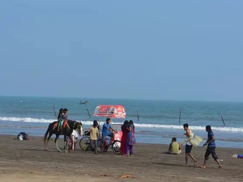 Manginapudi Beach during Masula Beach Festival 2025, showcasing vibrant activities and food stalls.