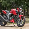 2025 TVS Apache RTR 160 in Matte Black with red alloy wheels on Andhra Pradesh street