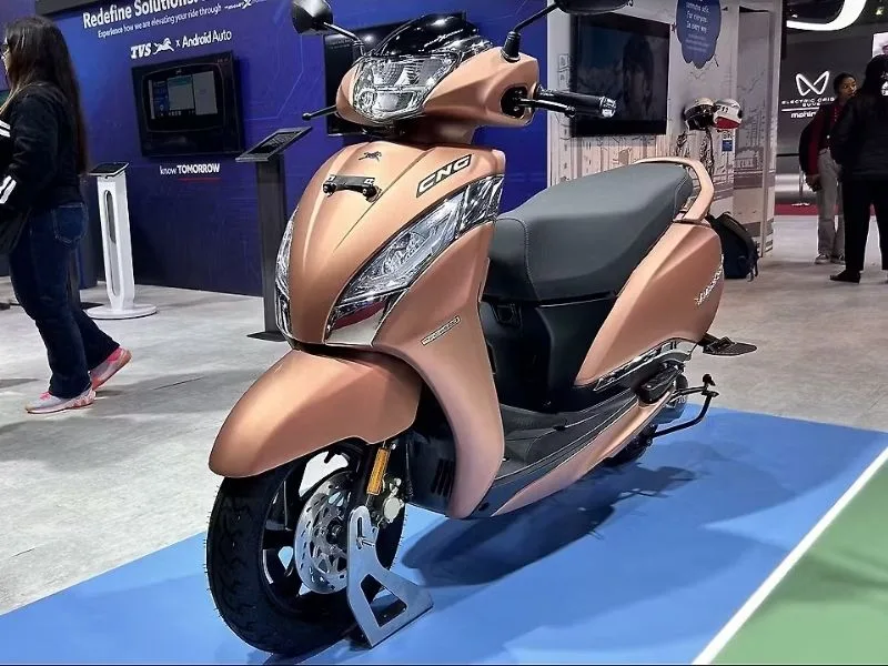 Digital display of TVS CNG scooter, showcasing features at India Mobility Expo 2025, priced at Rs 80,000 for budget riders.