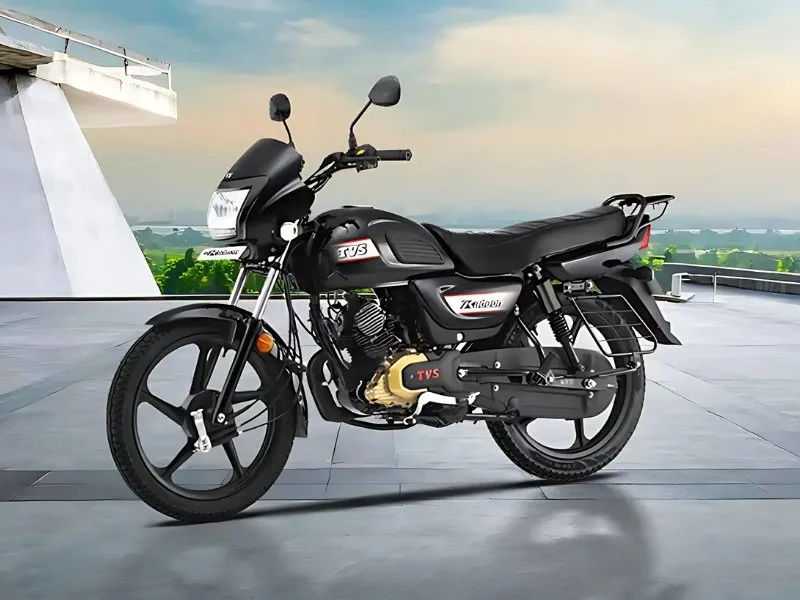 Analog instrument cluster of TVS Radeon 2025 with economy indicator, enhancing budget-friendly commuting experience