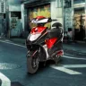 Ujaas eGo electric scooter 2025 in red color on Andhra Pradesh street