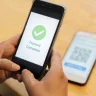 Smartphone displaying UPI transaction on PhonePe, Google Pay, or Paytm, highlighting faster processing starting June 16, 2025.